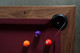 Detail of the Arthur Deco slate pool table with burgundy Championship felt and precision walnut rails by Doc & Holliday. Detail of the Arthur Deco slate pool table with burgundy Championship felt and precision walnut rails by Doc & Holliday.